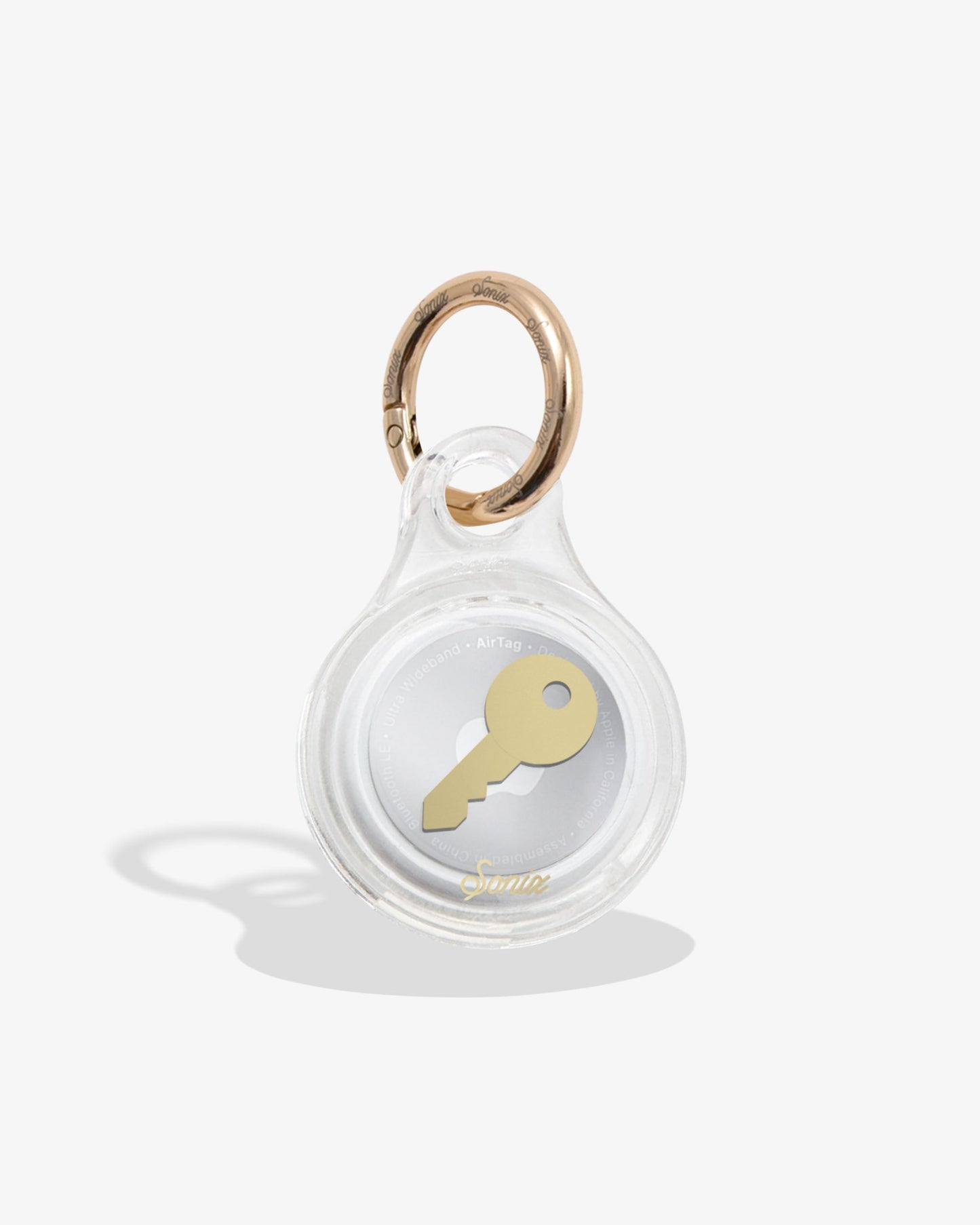 clear air tag cover with gold foil key