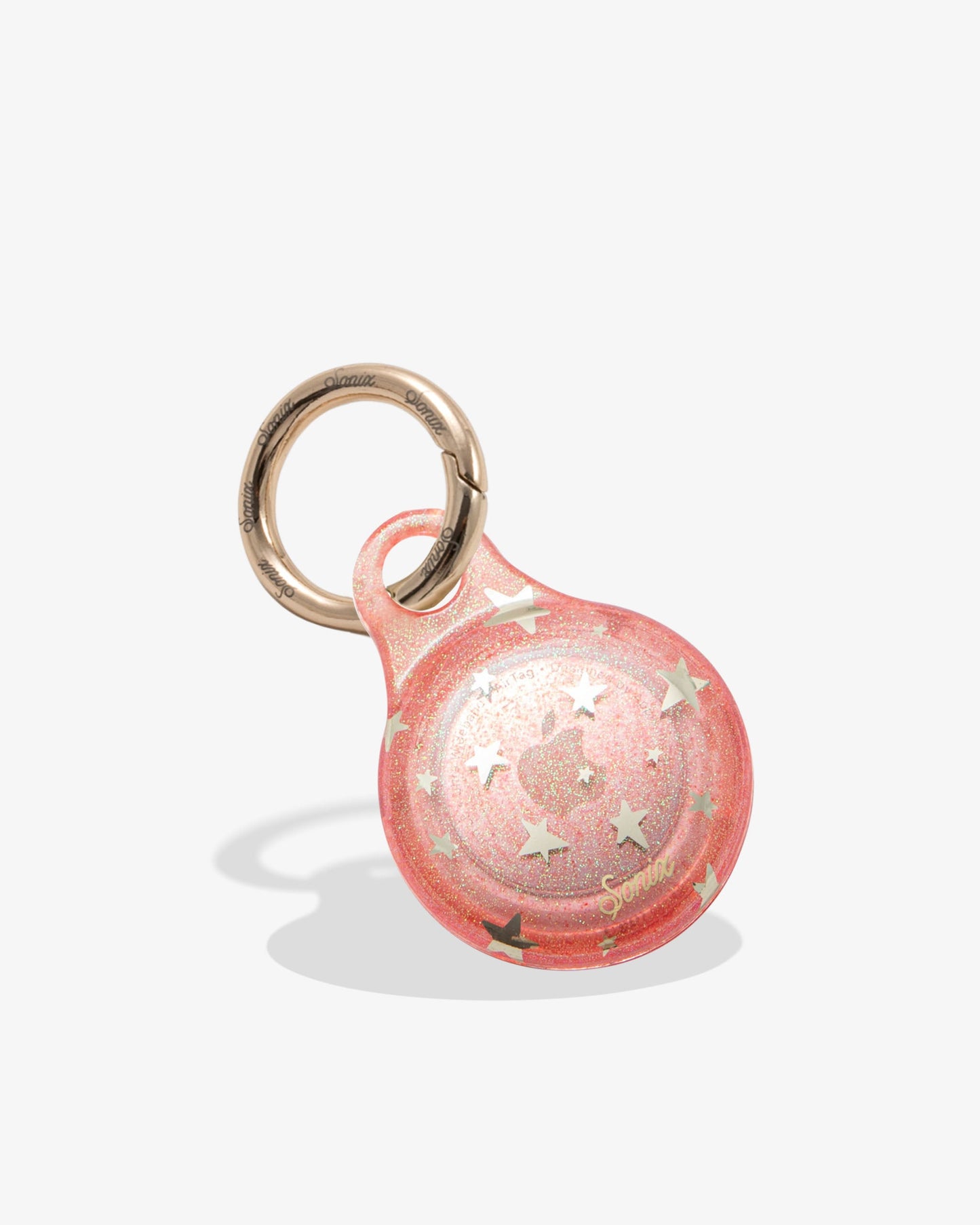 pink glitter airtag cover with metallic gold foil stars and gold ring