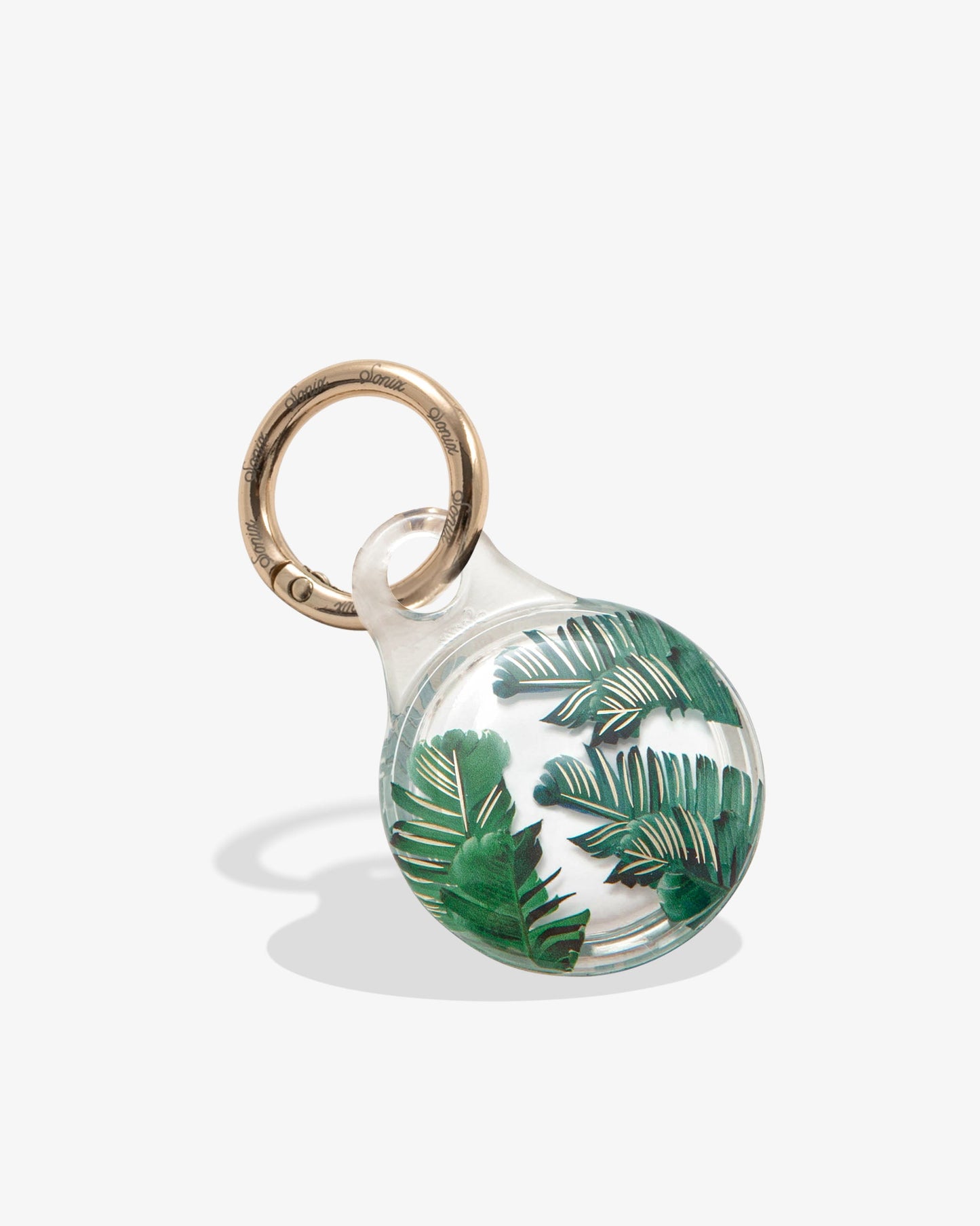 clear airtag case with green palm leaves with gold foil detail