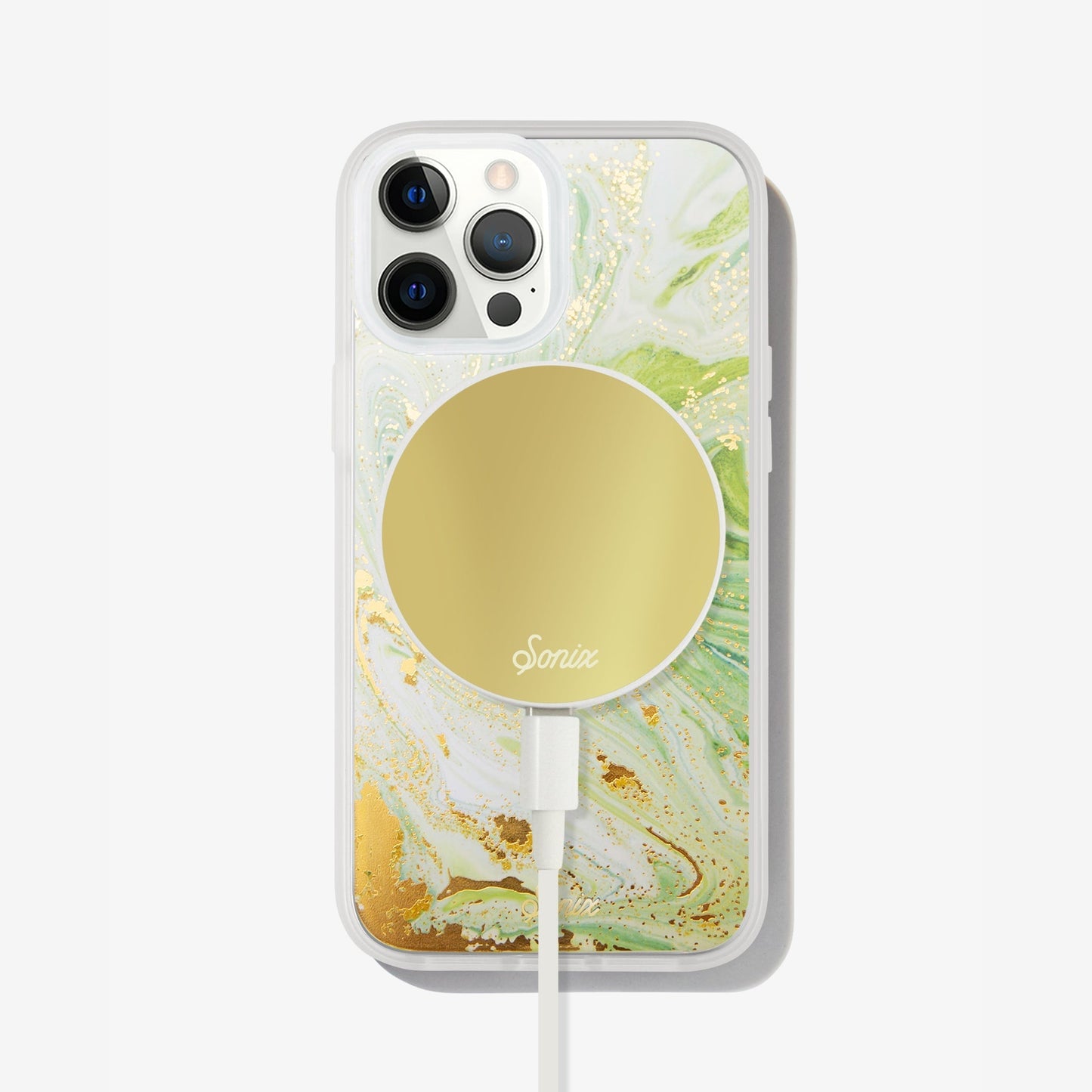 jade green marbled design with gold shimmer detailing shown on an iphone 12 pro with a gold maglink charger on the back