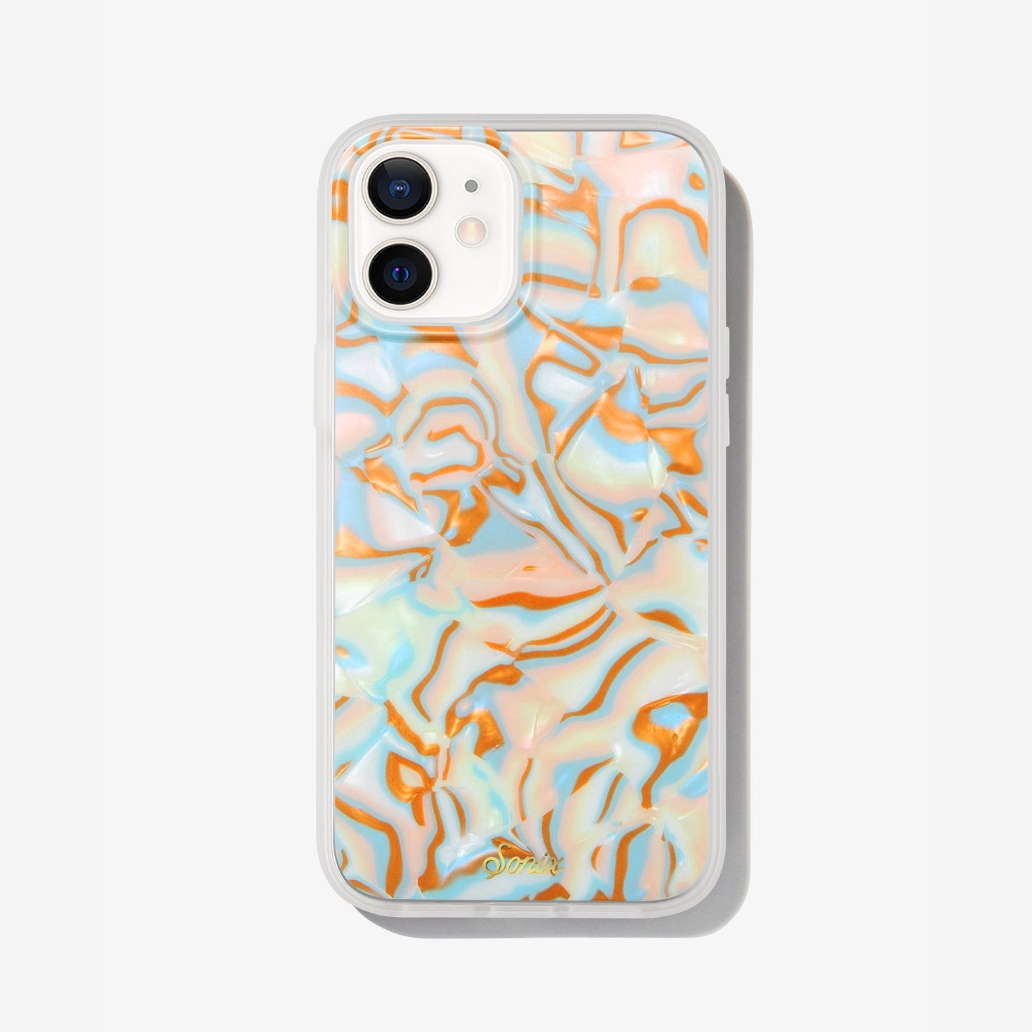metallic oranges, blues, and cream colors in a wavy 70's pattern shown on an iphone 12