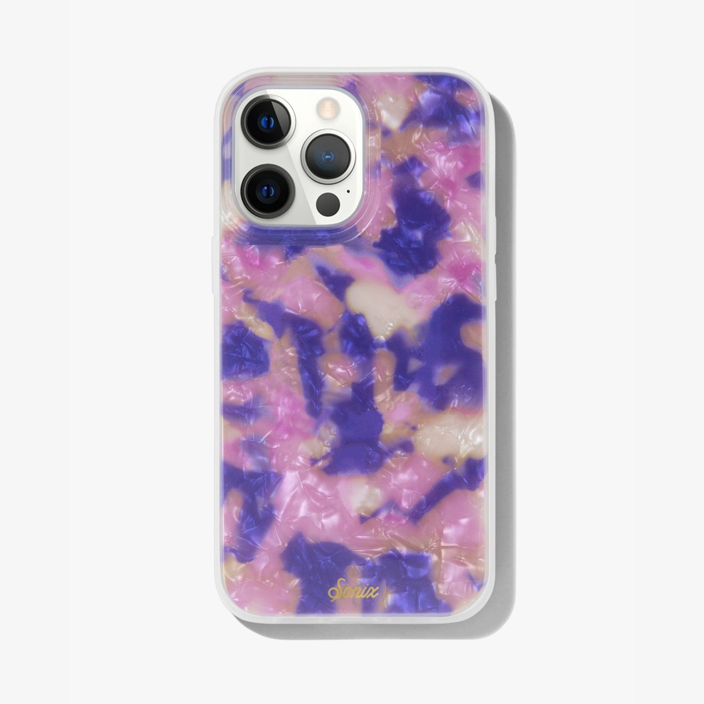 hazy illusion of pink, purple, and orange to create an appearance of a colorful mirage shown on an iphone 13 pro max