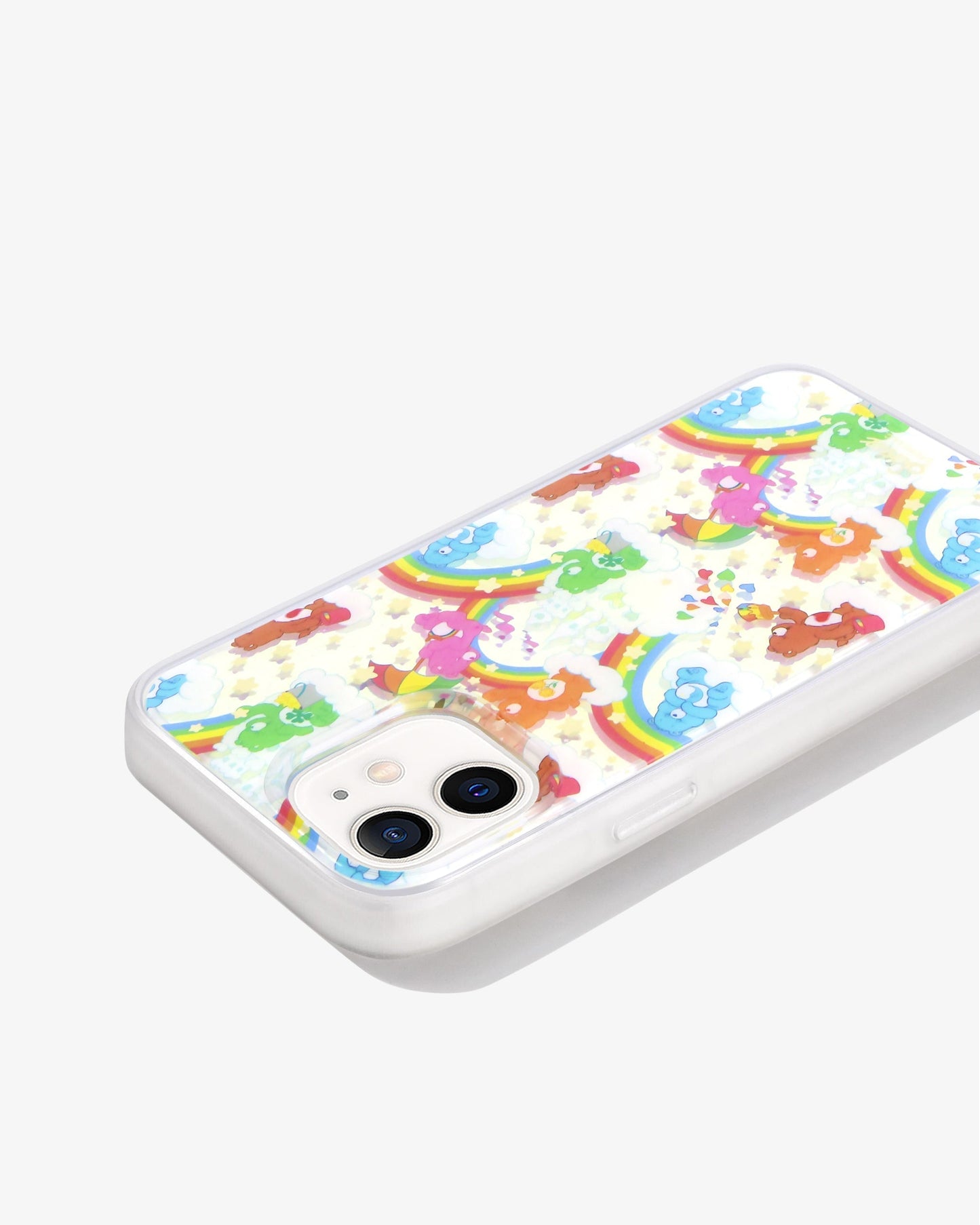 Care Bears: Friend Bear, Cheer Bear, Bedtime Bear, Goodluck Bear, and Tenderheart Bear having fun in a sandcastle dream with stars and rainbows shown on an iphone 12 side view