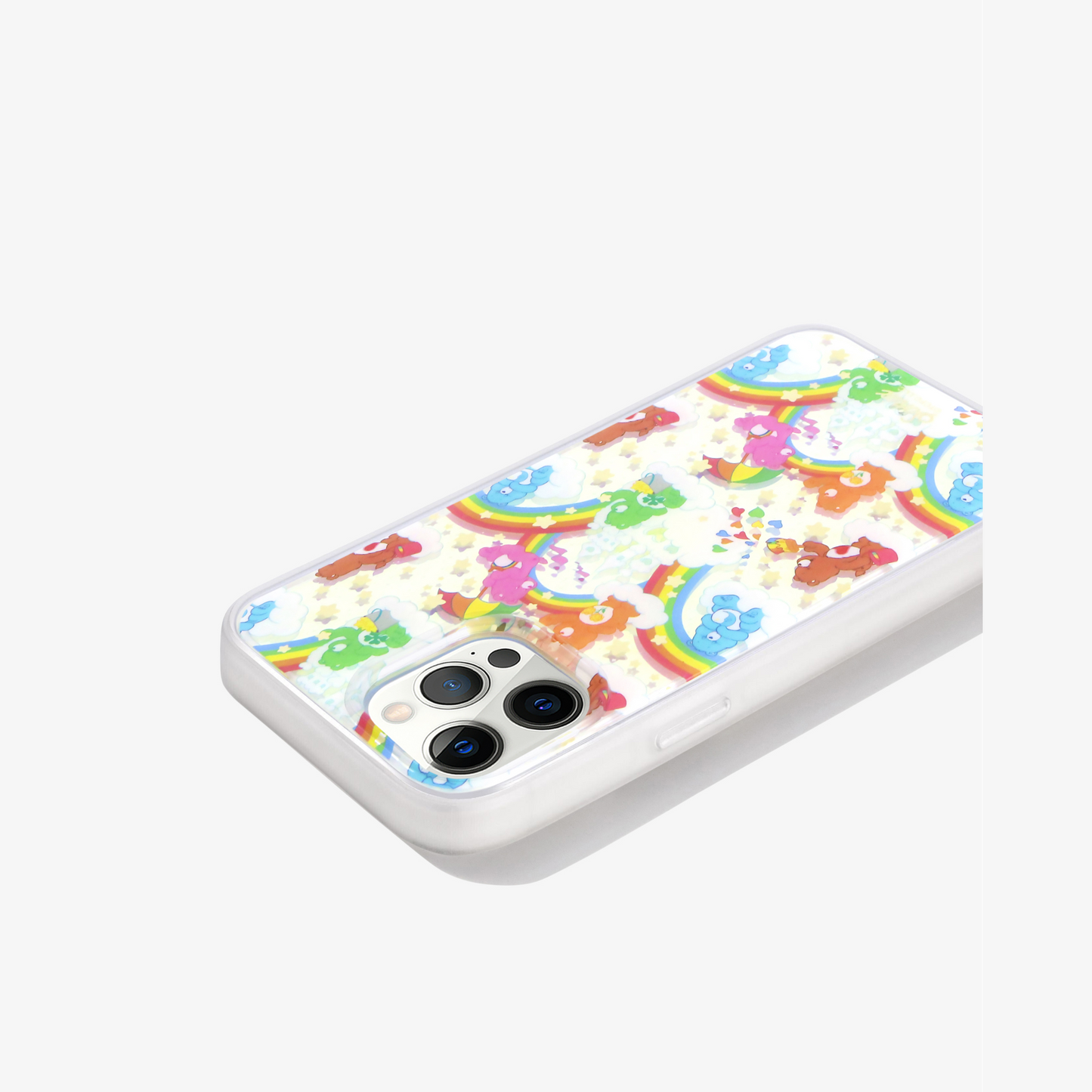 Care Bears: Friend Bear, Cheer Bear, Bedtime Bear, Goodluck Bear, and Tenderheart Bear having fun in a sandcastle dream with stars and rainbows shown on an iphone 12 pro side view