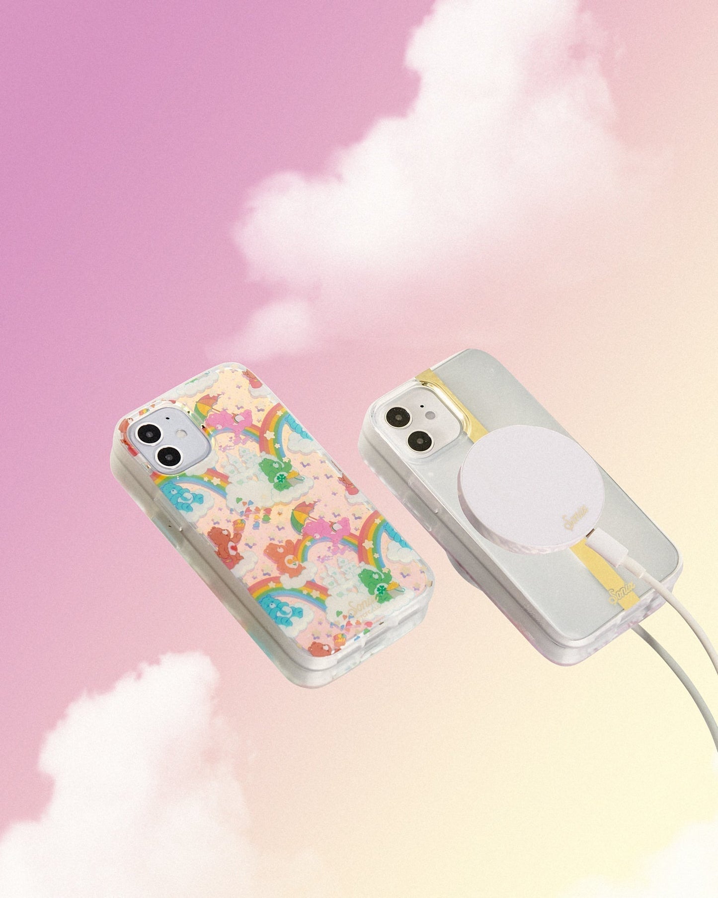 Care Bears: Friend Bear, Cheer Bear, Bedtime Bear, Goodluck Bear, and Tenderheart Bear having fun in a sandcastle dream with stars and rainbows shown on an iphone with a pink cloud background