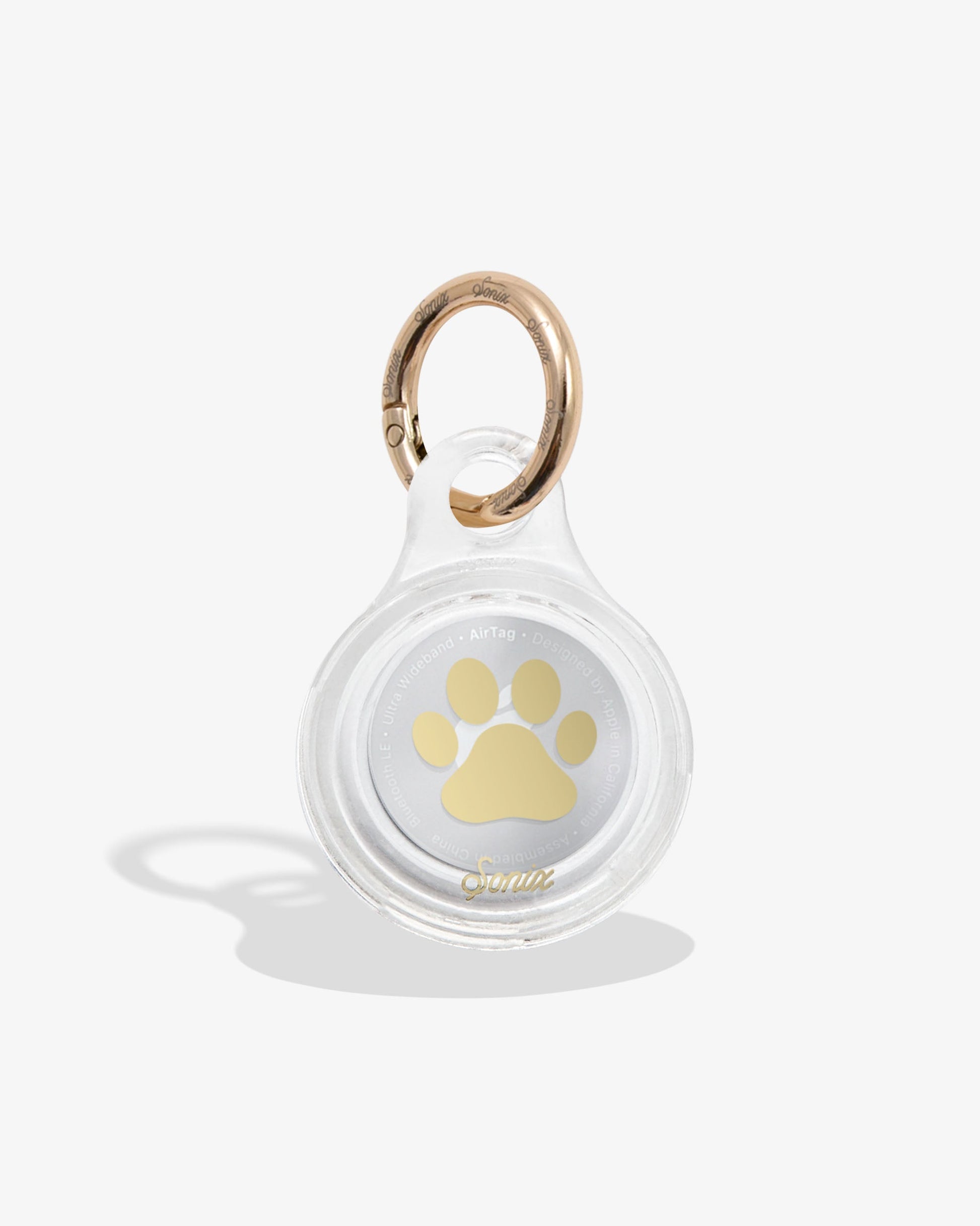 clear air tag cover with gold foil paw print