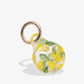 clear airtag cover with yellow lemons and green leaves with gold ring