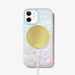 Pink and blue iphone case with gold stars, clouds, and hello kitty character cinnamoroll on an iphone 12 with a gold magsafe charger attached to the back