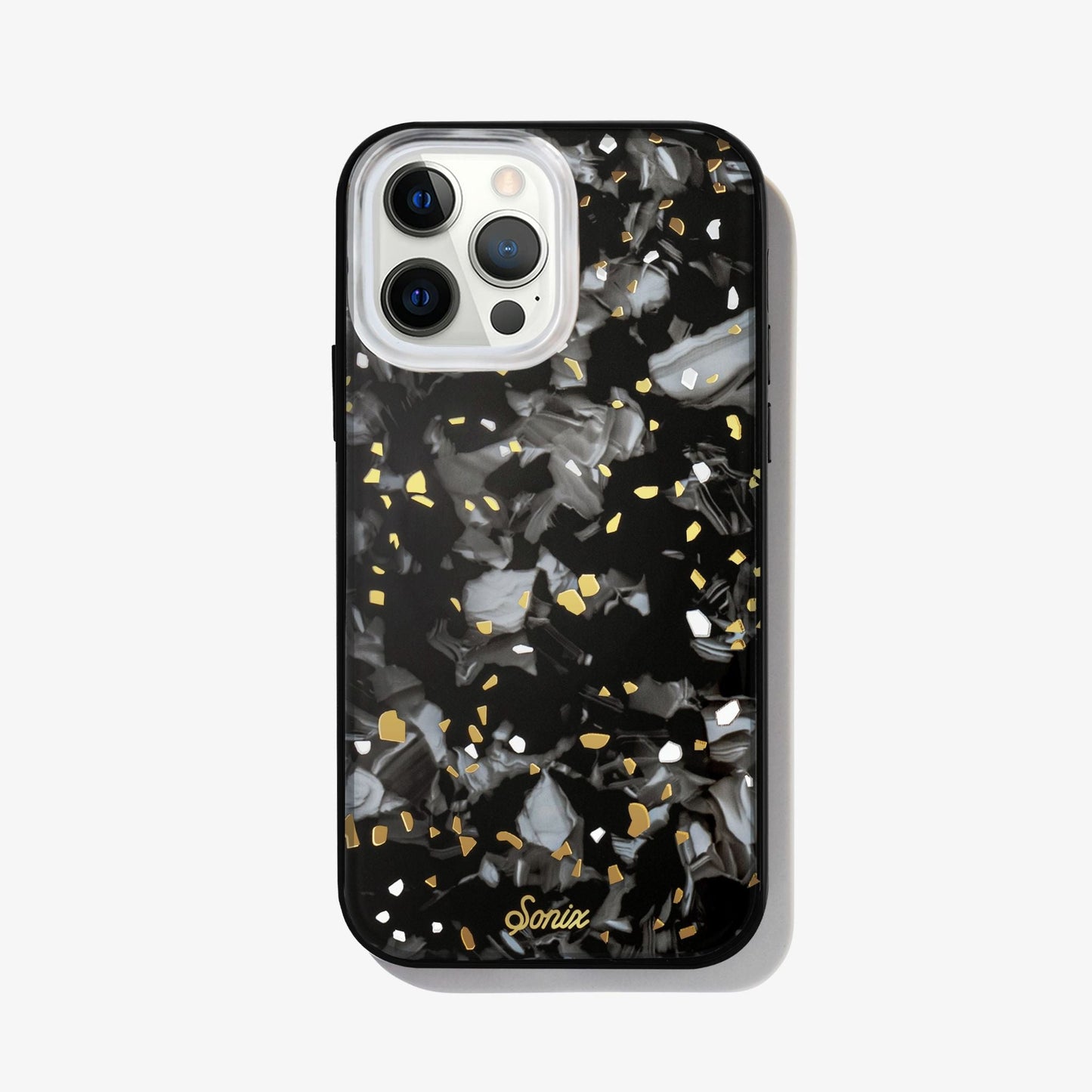 Dark galaxy rocks with highlights of gold and white on a black base.case shown on an iphone 12 pro