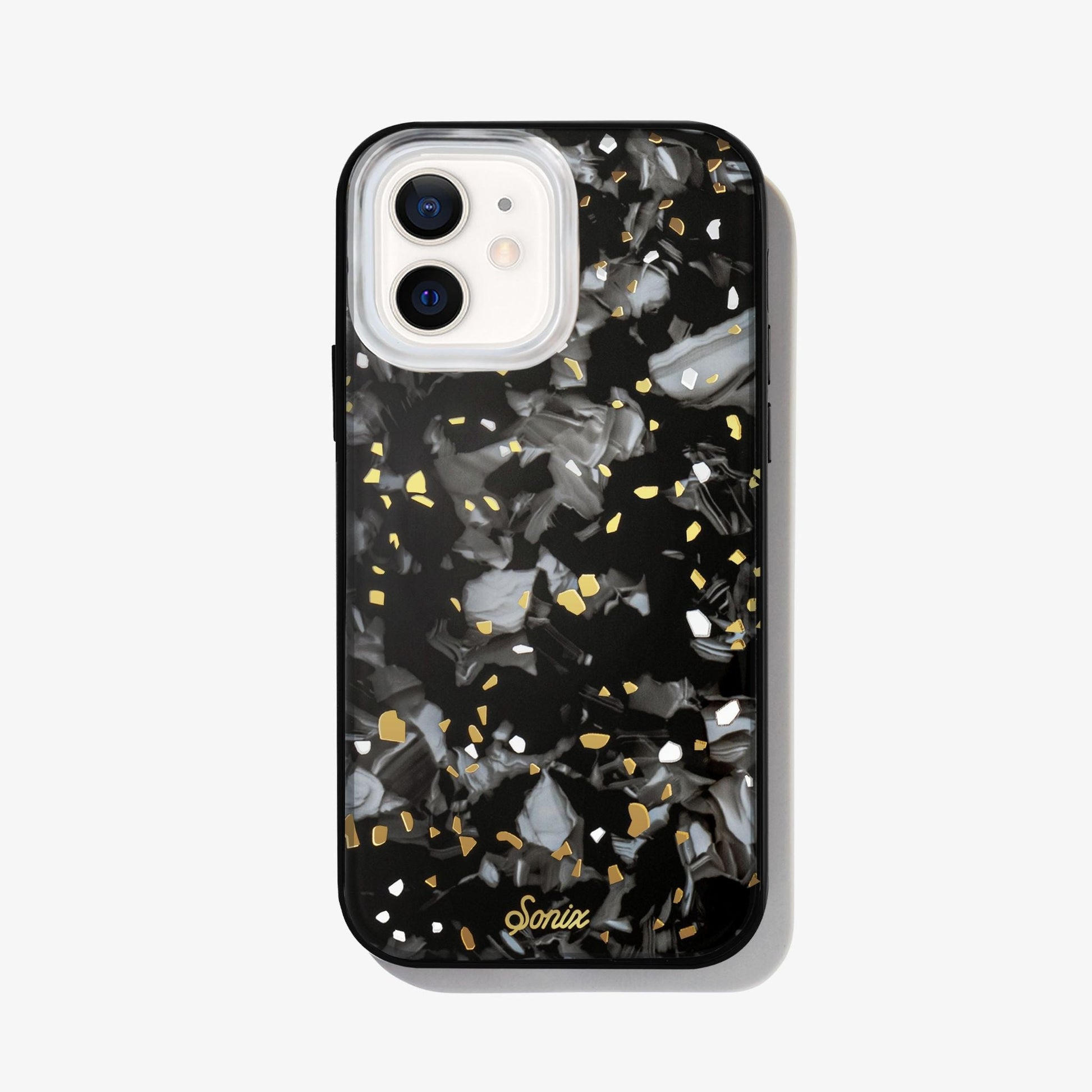 Dark galaxy rocks with highlights of gold and white on a black base.case shown on an iphone 12