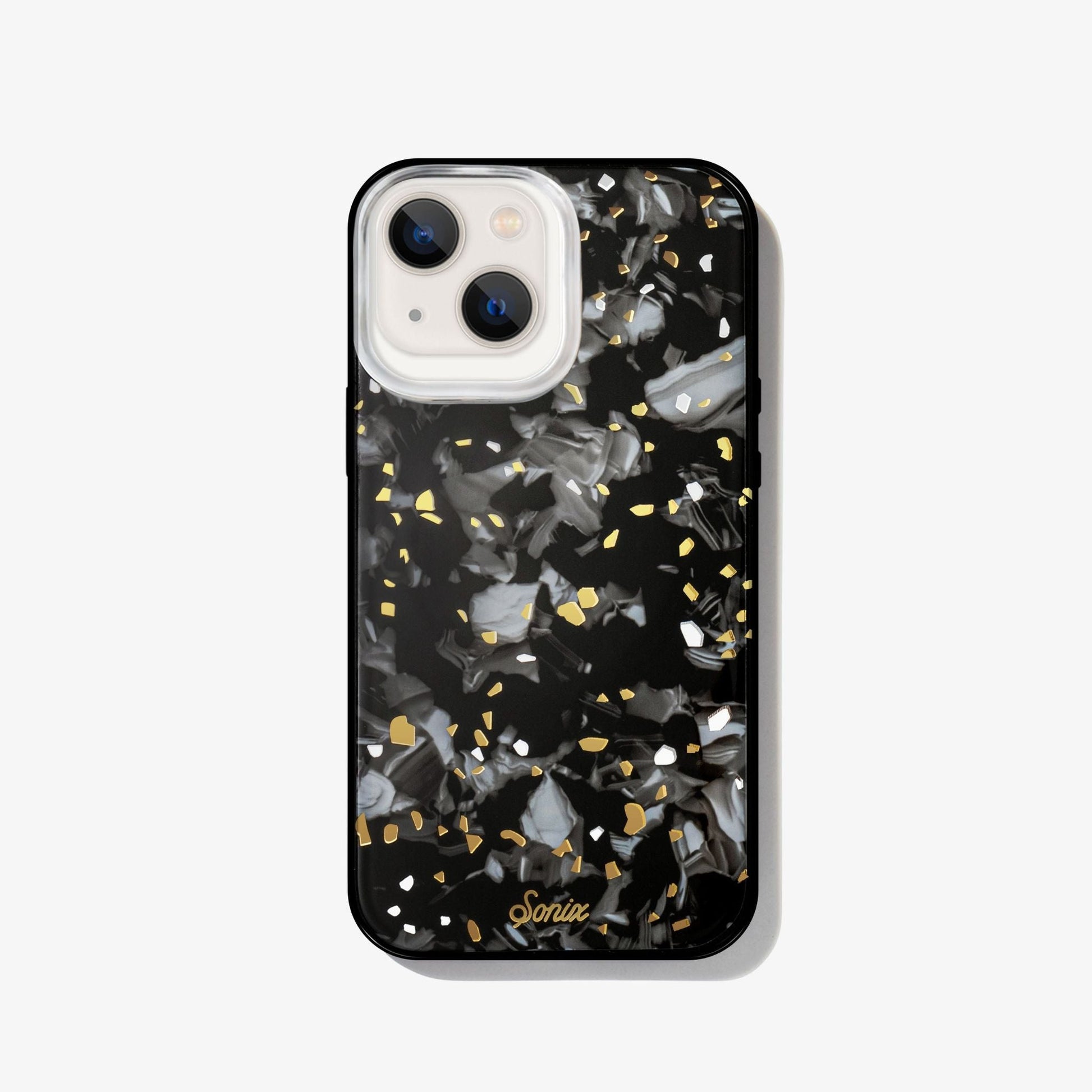 Dark galaxy rocks with highlights of gold and white on a black base.case shown on an iphone 13