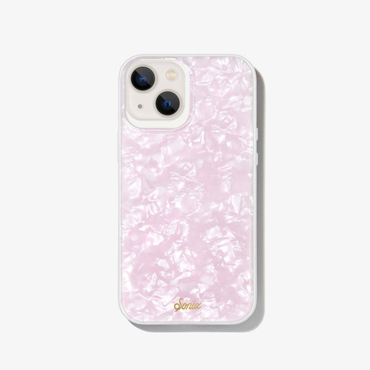 pink tort design with a shine that gleams in the light shown on an iphone 13 
