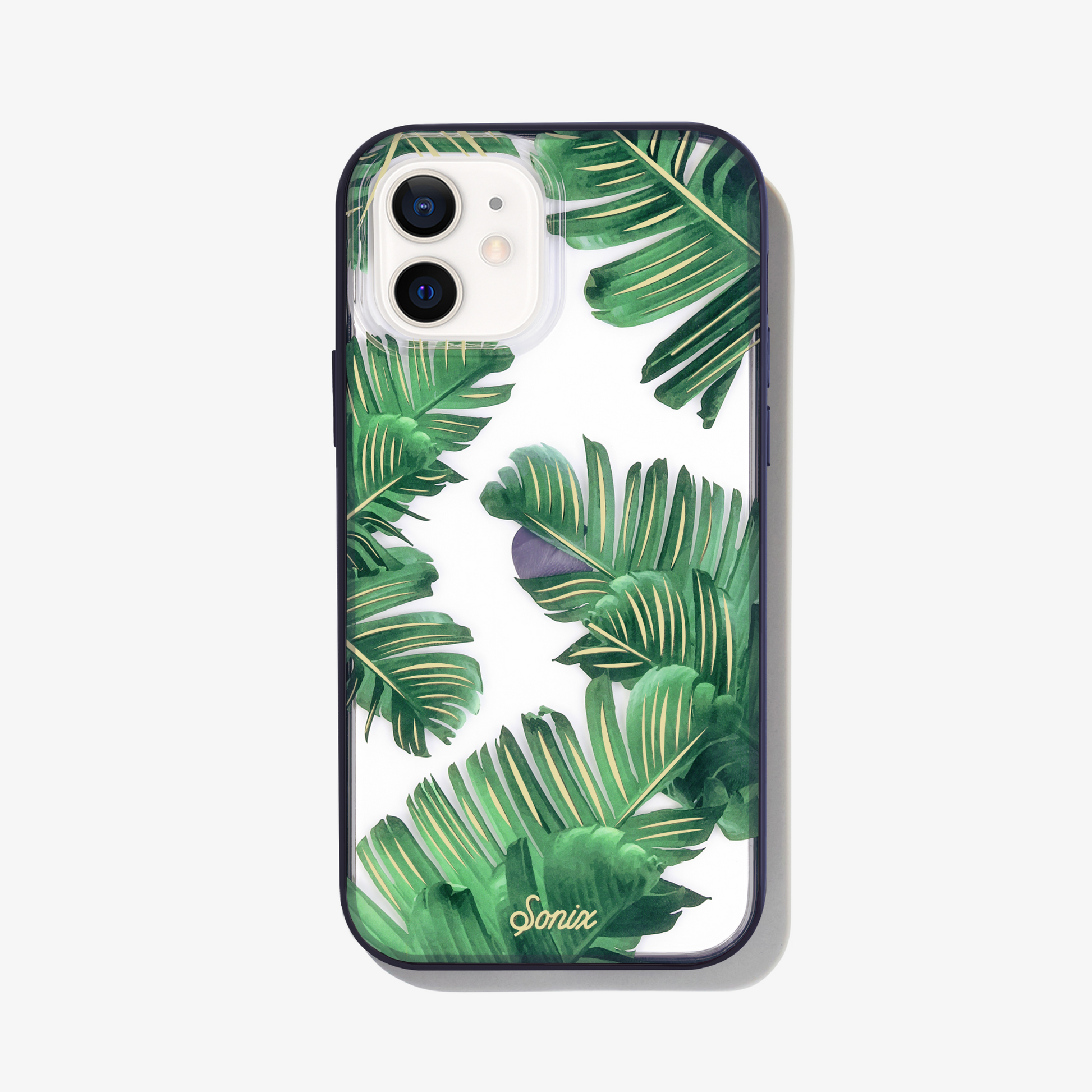 Bahama palm leaves iPhone 12 mini phone case on white phone.