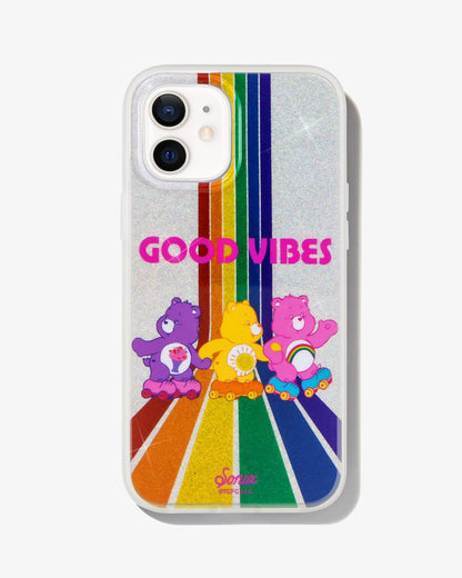 Care Bears: Share Bear, Funshine Bear, and Cheer Bear - skating down a rainbow road of glitter shown on a iphone 12